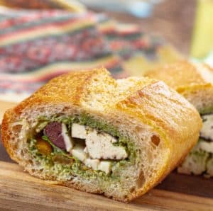 3 inch slices of filled pan bagnat with pesto