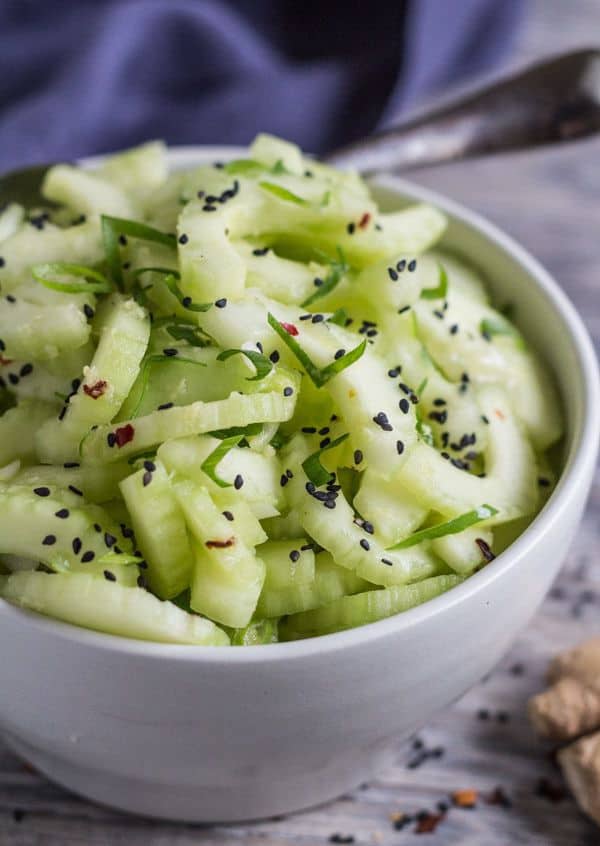 Sweet and Spicy Cucumber Ginger Salad in a bowl with black sesame seed sprinkle