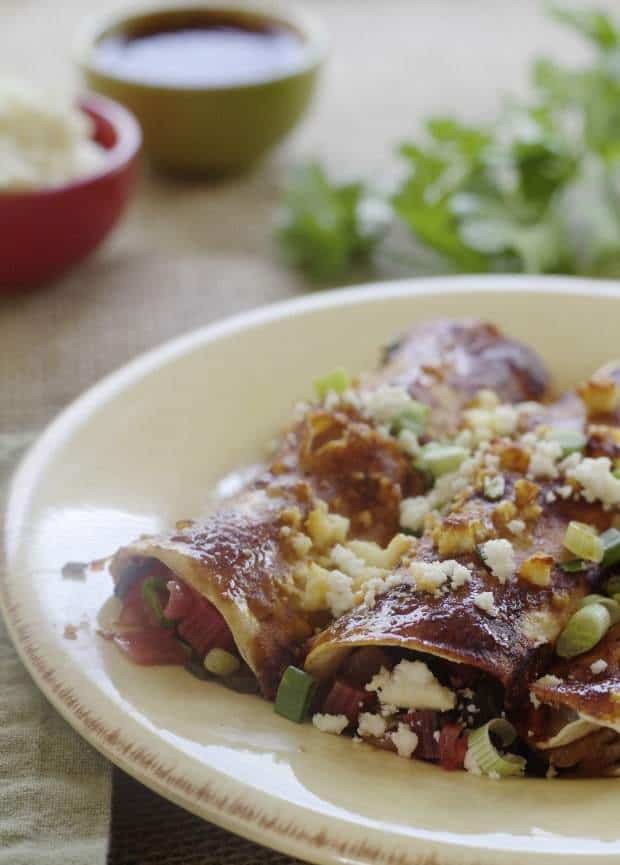Vegetarian Chard Enchiladas on plate ready to eat