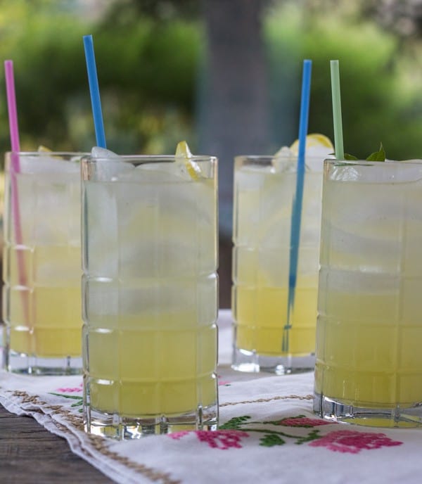 Lemon Basil Lemonade in 4 tall glasses with straws