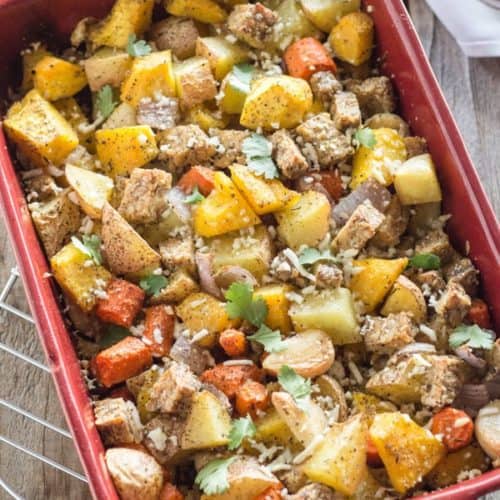 Roasted Fall Vegetables and Tamari Tempeh in red casserole dish
