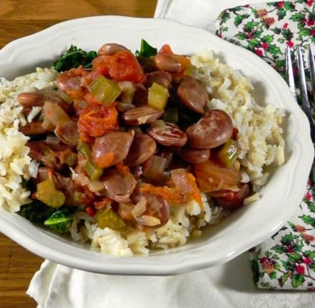 Christmas Lima Beans with Celery and Tomato with rice and greens in white bowl ove