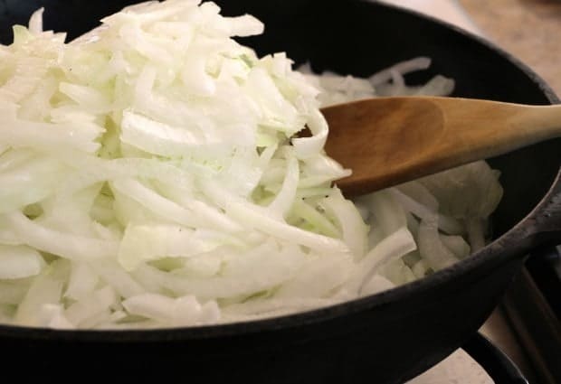 onions in skillet for Caramelized Onion and Arugula Tostadas