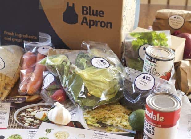 Blue Apron Box unpacked with ingredients and recipe cards