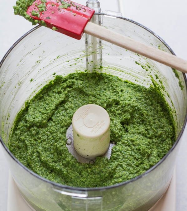 Garlic Scape and Mess O' Greens Pesto in food processor ready to eat
