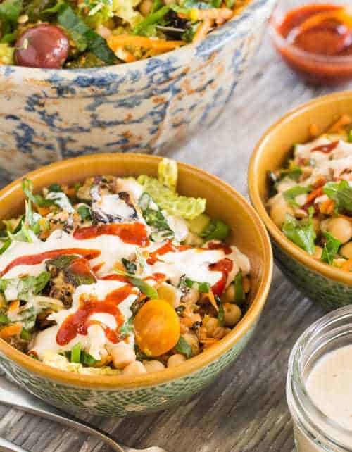 Summer Harvest Salad with Chickpeas and Wheat Berries in bowls with 2 dressings