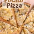 baked Potato Pesto Pizza on wooden board cut, with text for Pinterest