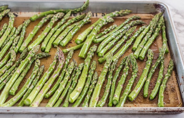 asparagus ready for the oven--for Roasted Asparagus and Sweet Potato Noodles with Goat Cheese Sauce