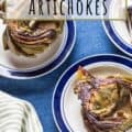 plated lemon roasted artichokes on blue tablecloth with text for Pinterest