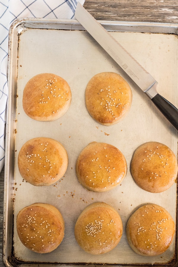 Homemade Whole Wheat Burger Buns on sheet pan ready to slice | Letty's Kitchen