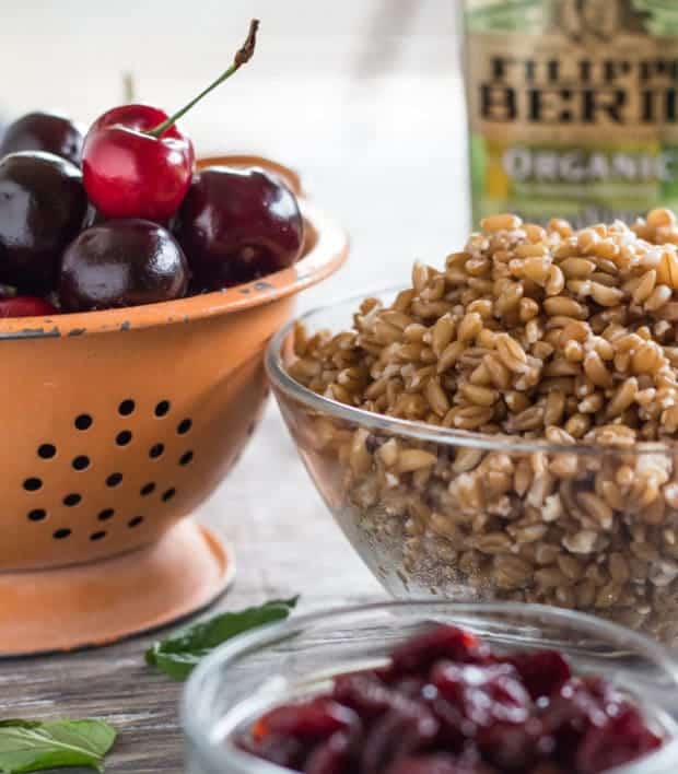 cooked farro and colander of cherries for Cherry and Farro Salad with Pressure-Cooked Farro 