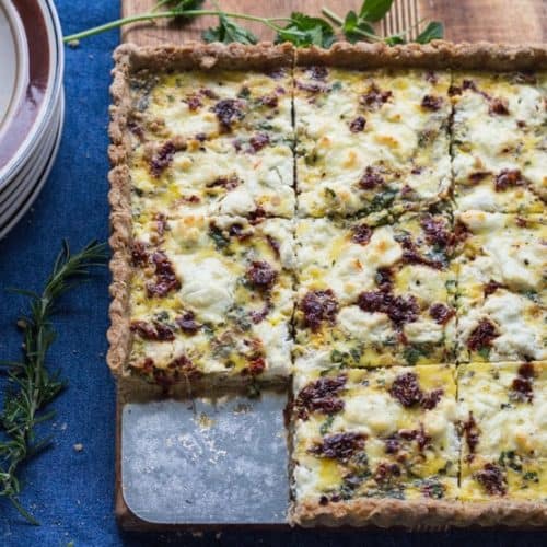 Herbed Goat Cheese and Caramelized onion Tart with one piece out