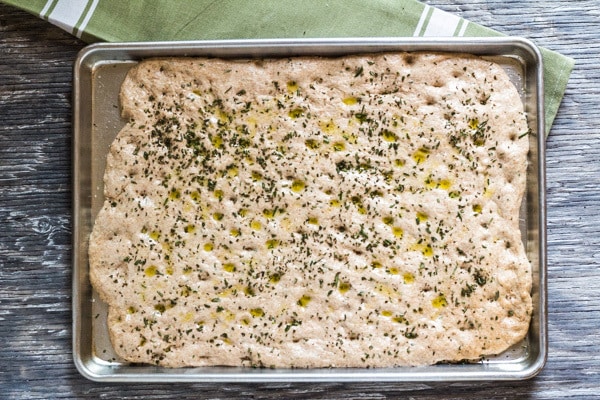 Spread in pan and ready to bake-- Easy Whole Wheat Rosemary Focaccia