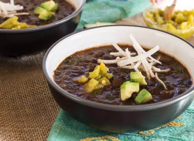 Spicy Black Bean Chili with Hearty Greens in bowl horizontal photo