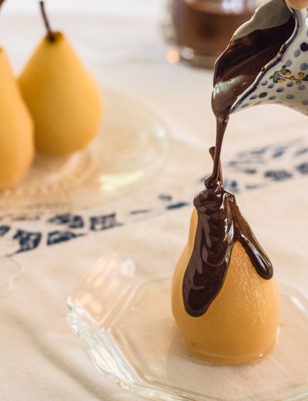 Pouring chocolate sauce on Cinnamon Poached Pears with Chocolate Sauce | Letty's Kitchen