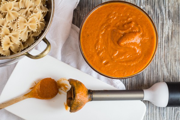 Tomato Carrot Marinara Sauce in bowl, overhead shot with immersion blender