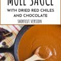 cast iron skillet filled with red chile mole sauce with Pinerest text
