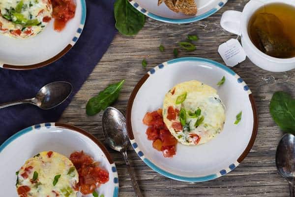 Instant Pot Breakfast Egg Muffins with Parmesan, Spinach, and Tomatoes overhead plated