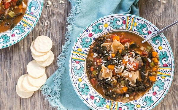 bowl of Lasagna Minestrone Soup with Lentils and Kale overhead vertical shot