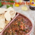 Homemade Mexican Tomato Salsa in Mexican terra cotta bowl with chips with text for Pinterest