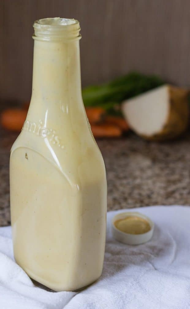 Mellow Miso Salad Dressing in bottle on a white towel