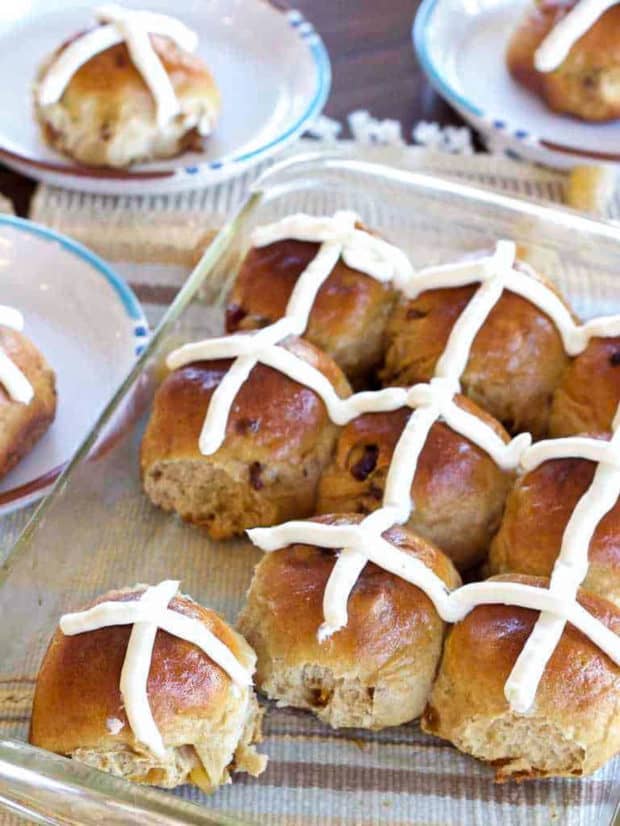 Hot Cross Buns in glass pan and on plates.